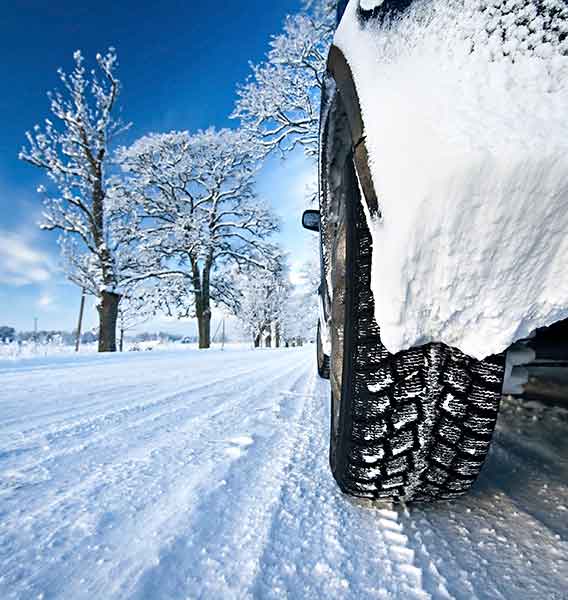 Car covered in snow in the winter