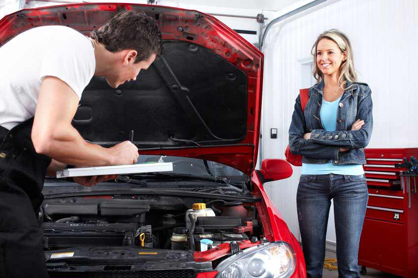 Auto mechanic with client